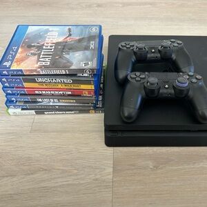 PlayStation 4 (PS4) with 2 controllers and 6 games